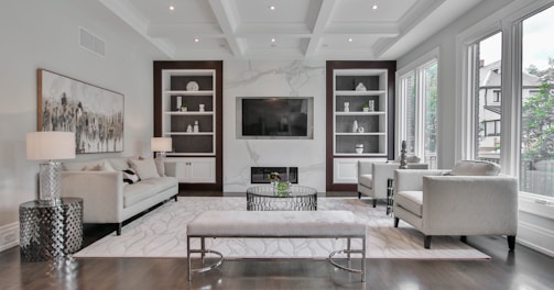 white wooden coffee table near white sofa