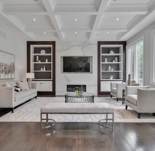 white wooden coffee table near white sofa