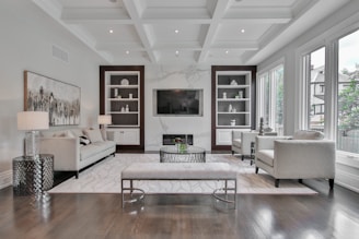 white wooden coffee table near white sofa