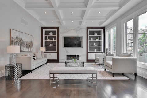 white wooden coffee table near white sofa