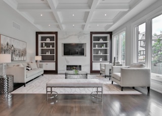 white wooden coffee table near white sofa