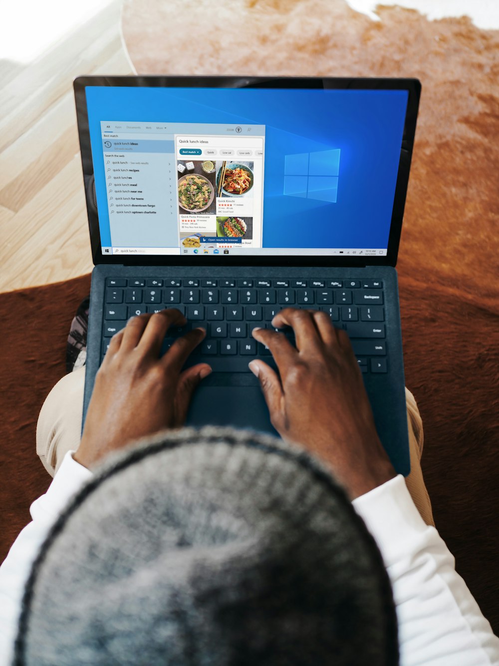 person using black laptop computer