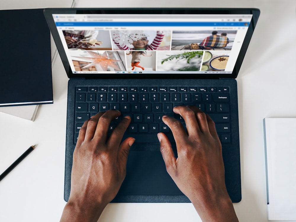 person using black and silver laptop computer