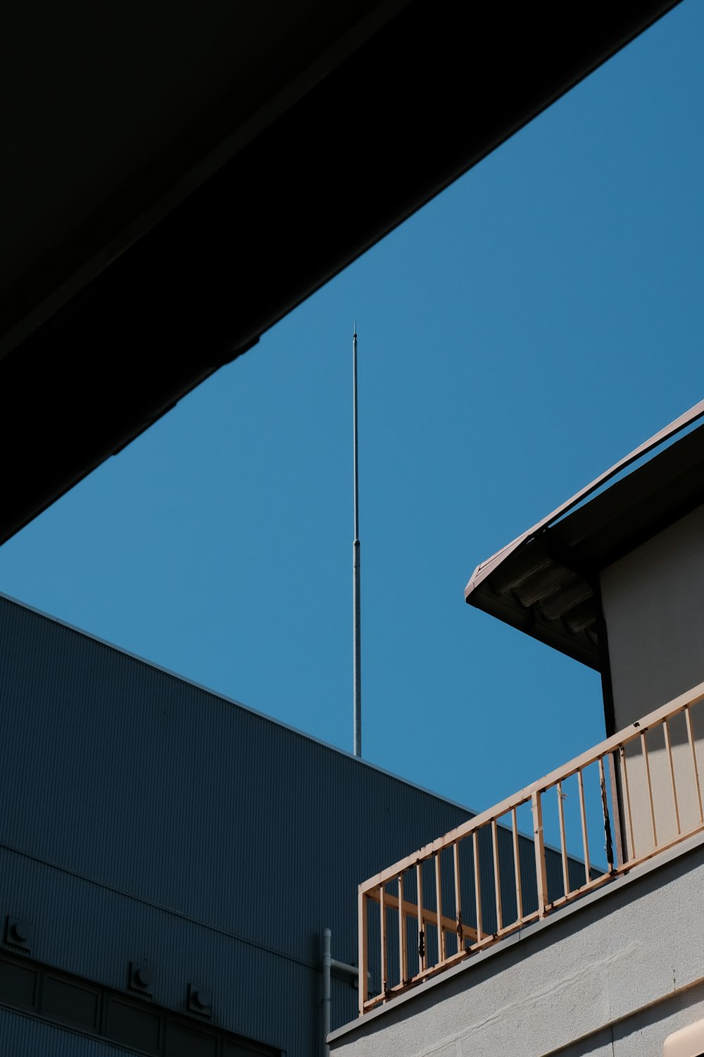 black and white concrete building under blue sky during daytime