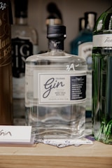 a bottle of gin sitting on top of a table