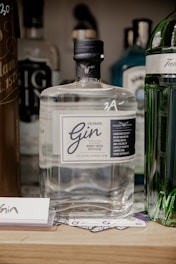 a bottle of gin sitting on top of a table