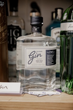 a bottle of gin sitting on top of a table