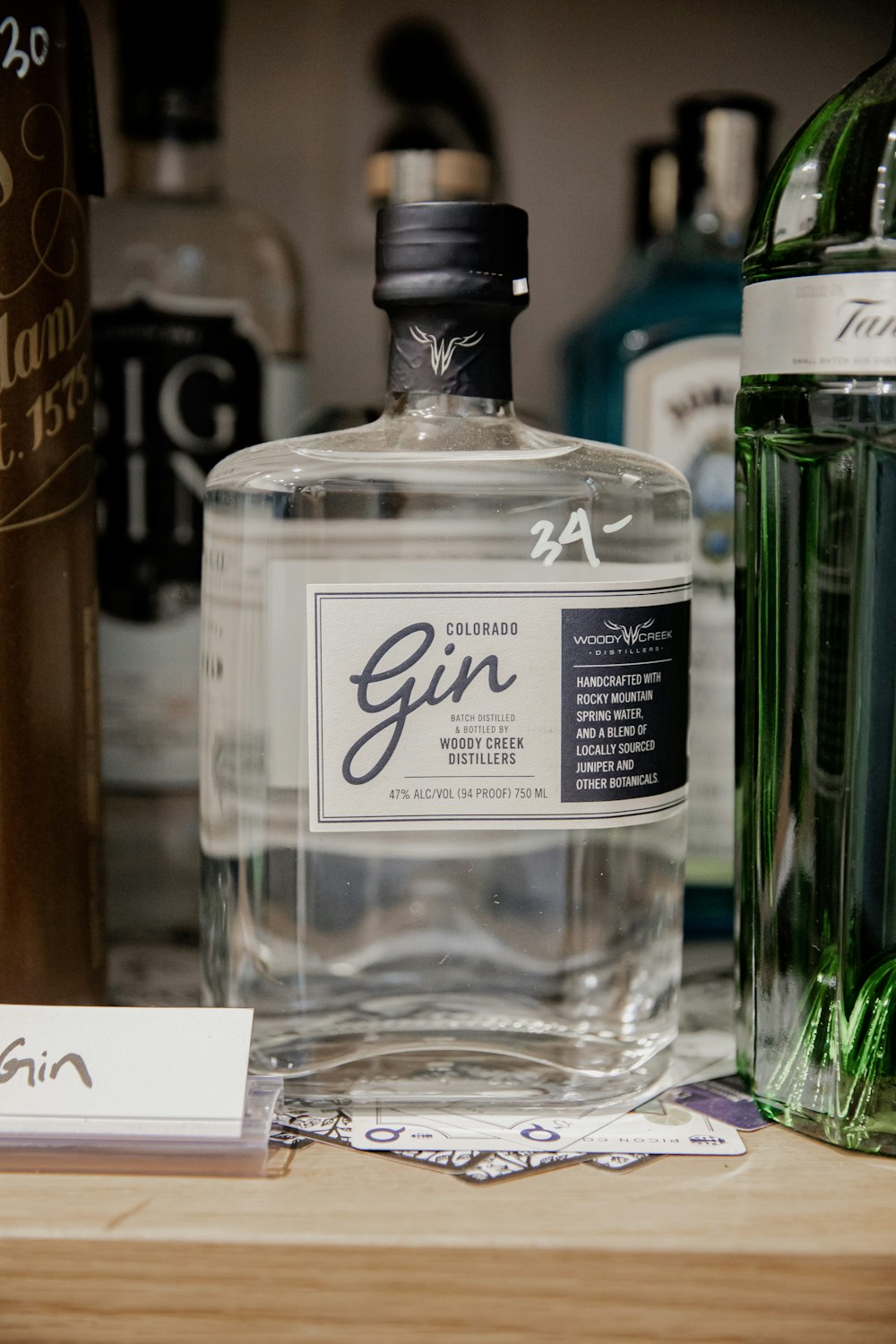 a bottle of gin sitting on top of a table