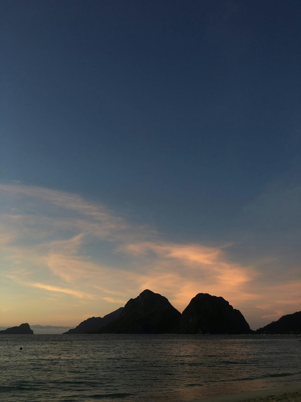 silhouette of mountain during sunset