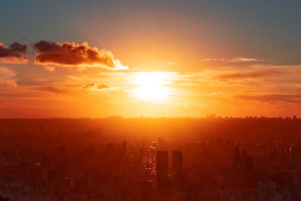 silhouette of city buildings during sunset