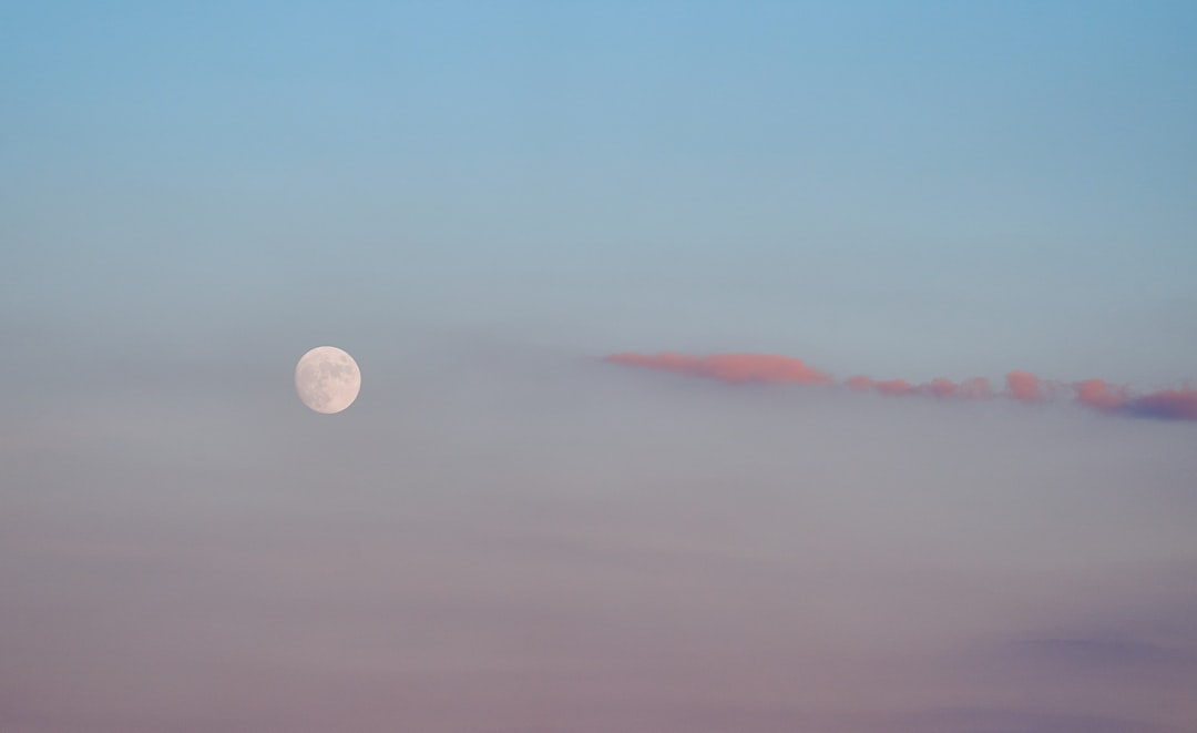 full moon over the clouds