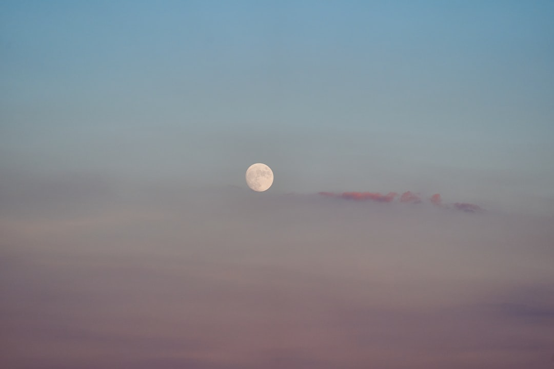 full moon over the clouds