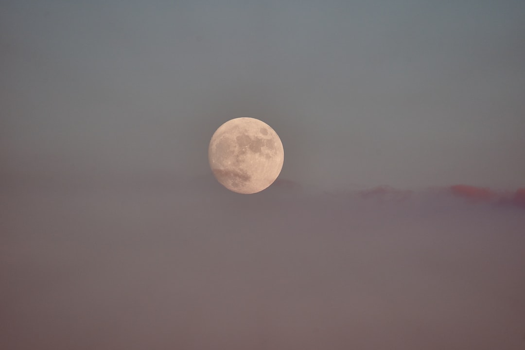 full moon over the clouds