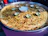 A close-up of a steaming hot, golden-brown paratha served with vibrant chutneys and a side of fresh salad.