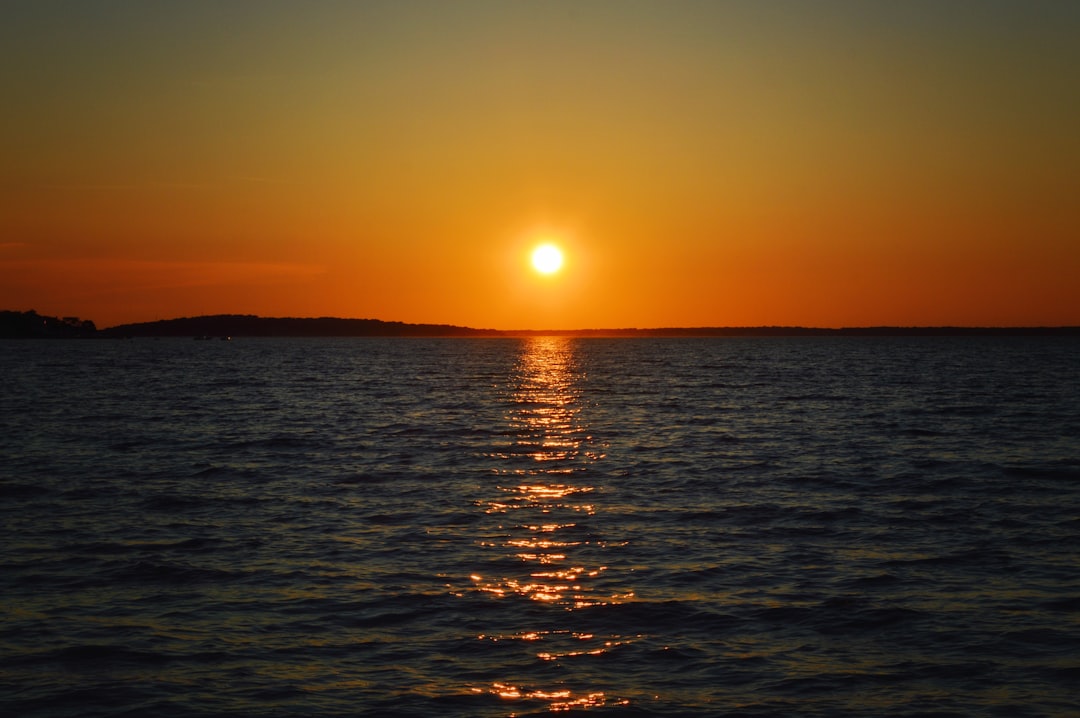 body of water during sunset