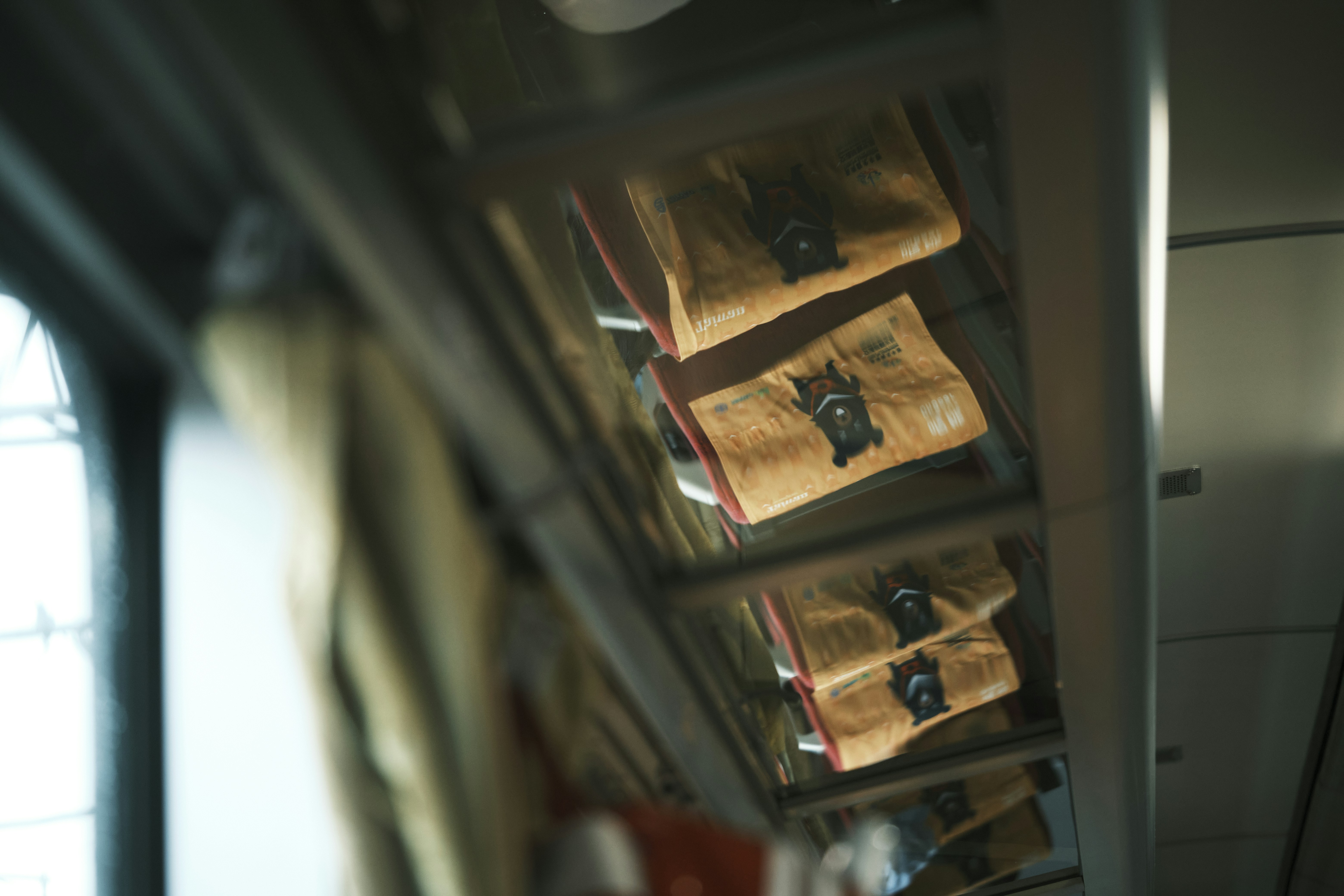 brown wooden book shelf with books