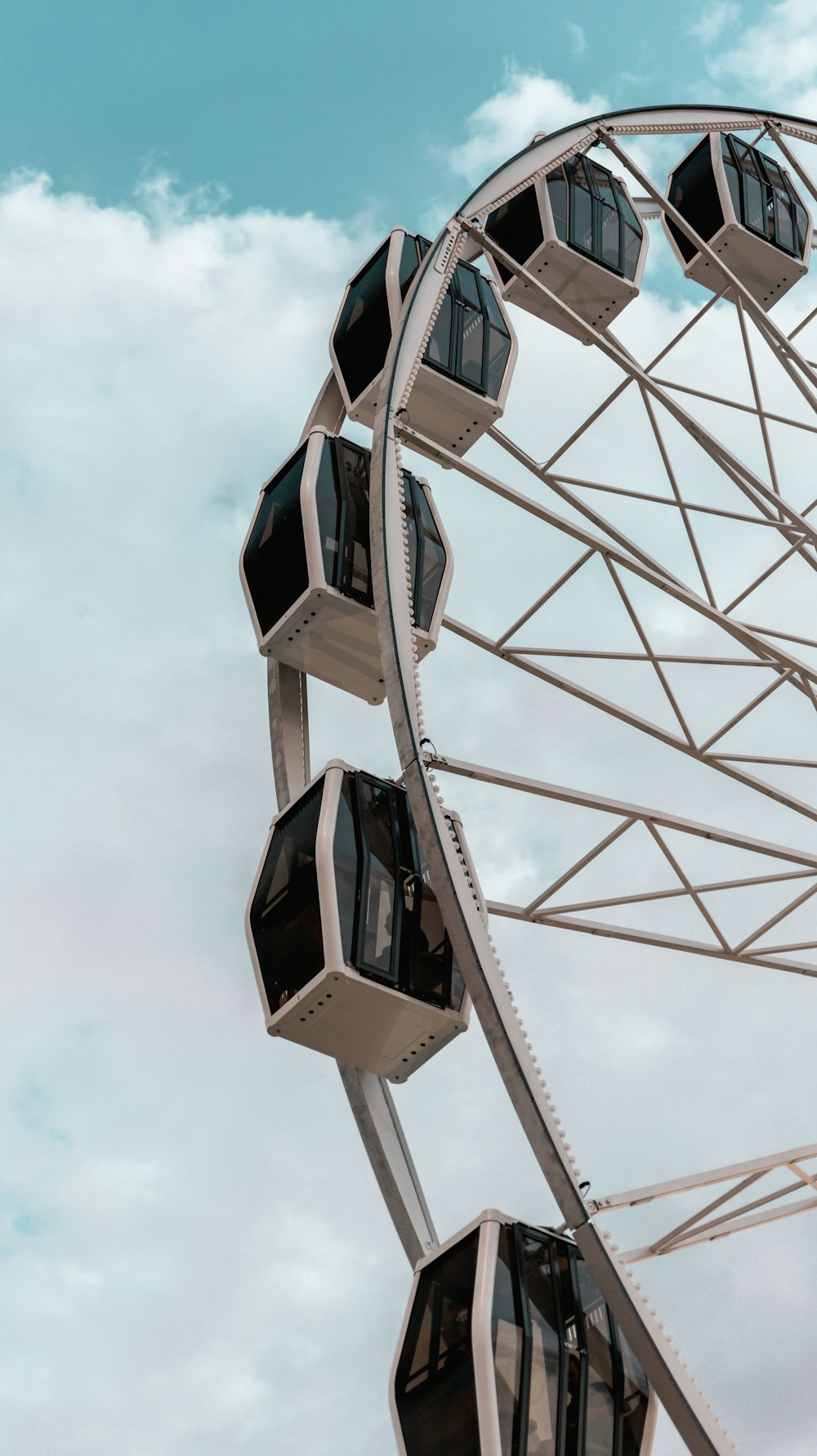 white and blue ferris wheel under blue sky during daytime