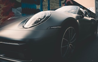 Vibrant orange sports car wrapped with a smooth matte finish on a city street