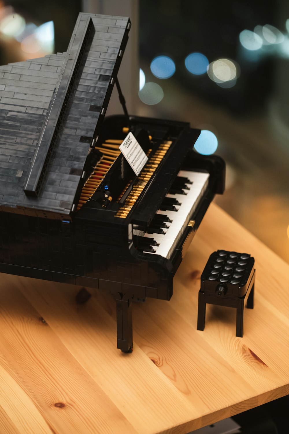 black piano keyboard on brown wooden floor