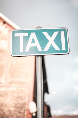 a close up of a street sign with a building in the background