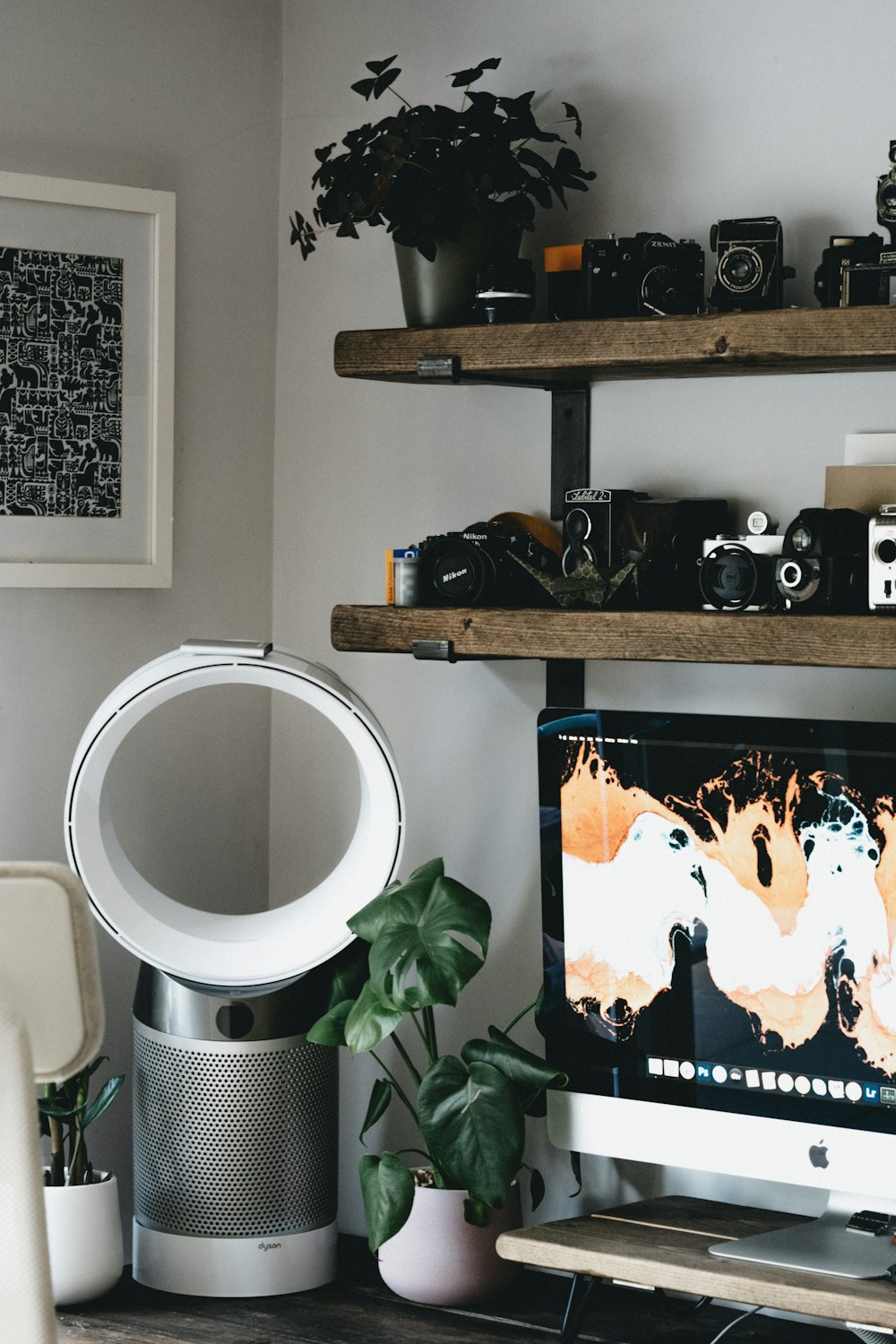 white and gray round framed mirror