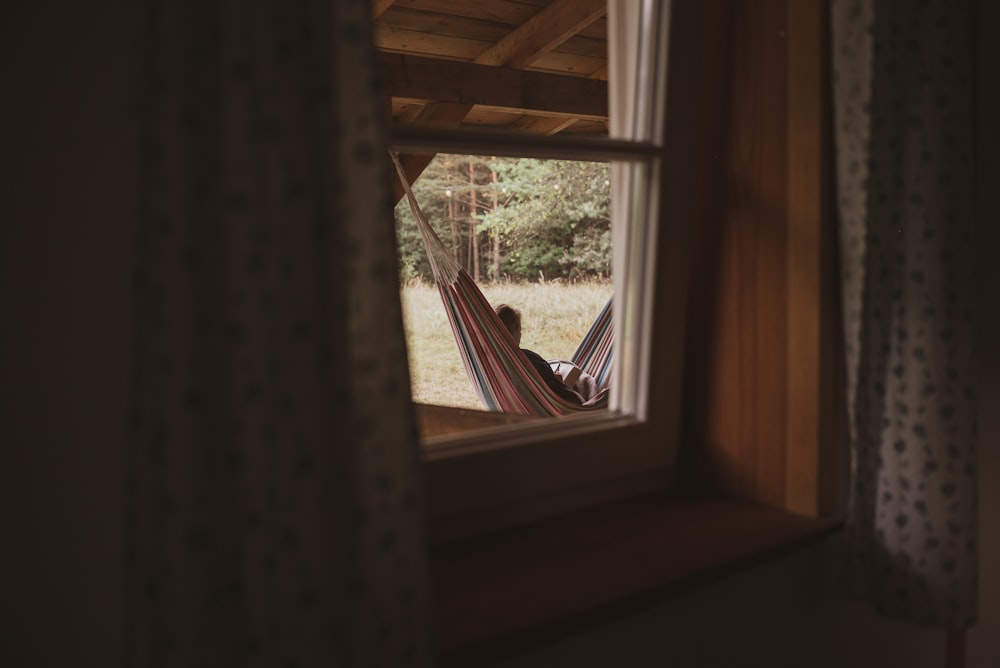 brown wooden framed glass window