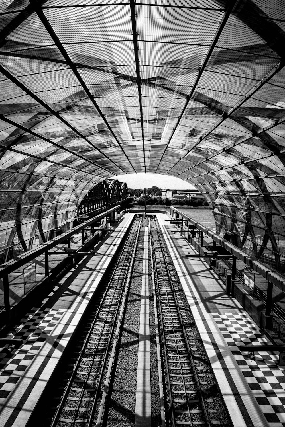 grayscale photo of a train station