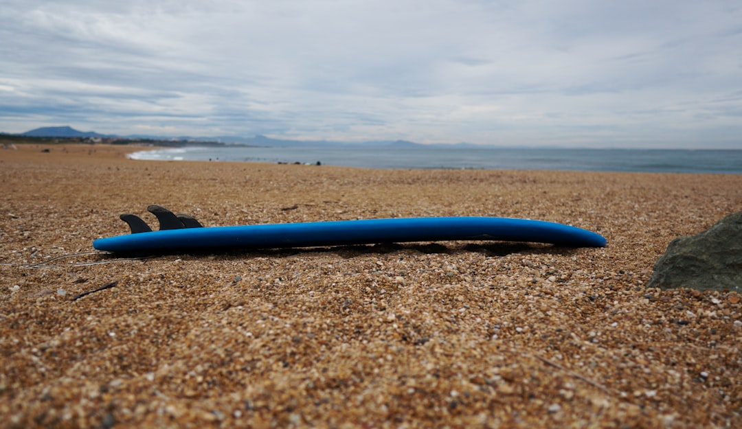 blue plastic tube on beach during daytime