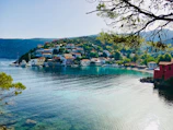 houses near body of water during daytime