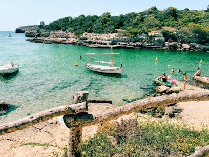 white and black boat on sea during daytime