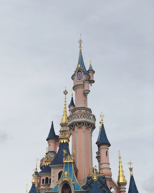 blue and white concrete building under white sky during daytime in Sleeping Beauty Castle France