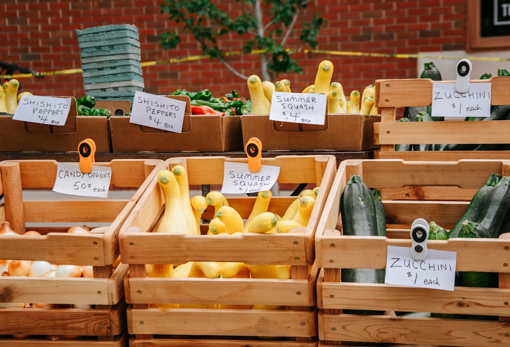 yellow and green vegetables on brown wooden crate