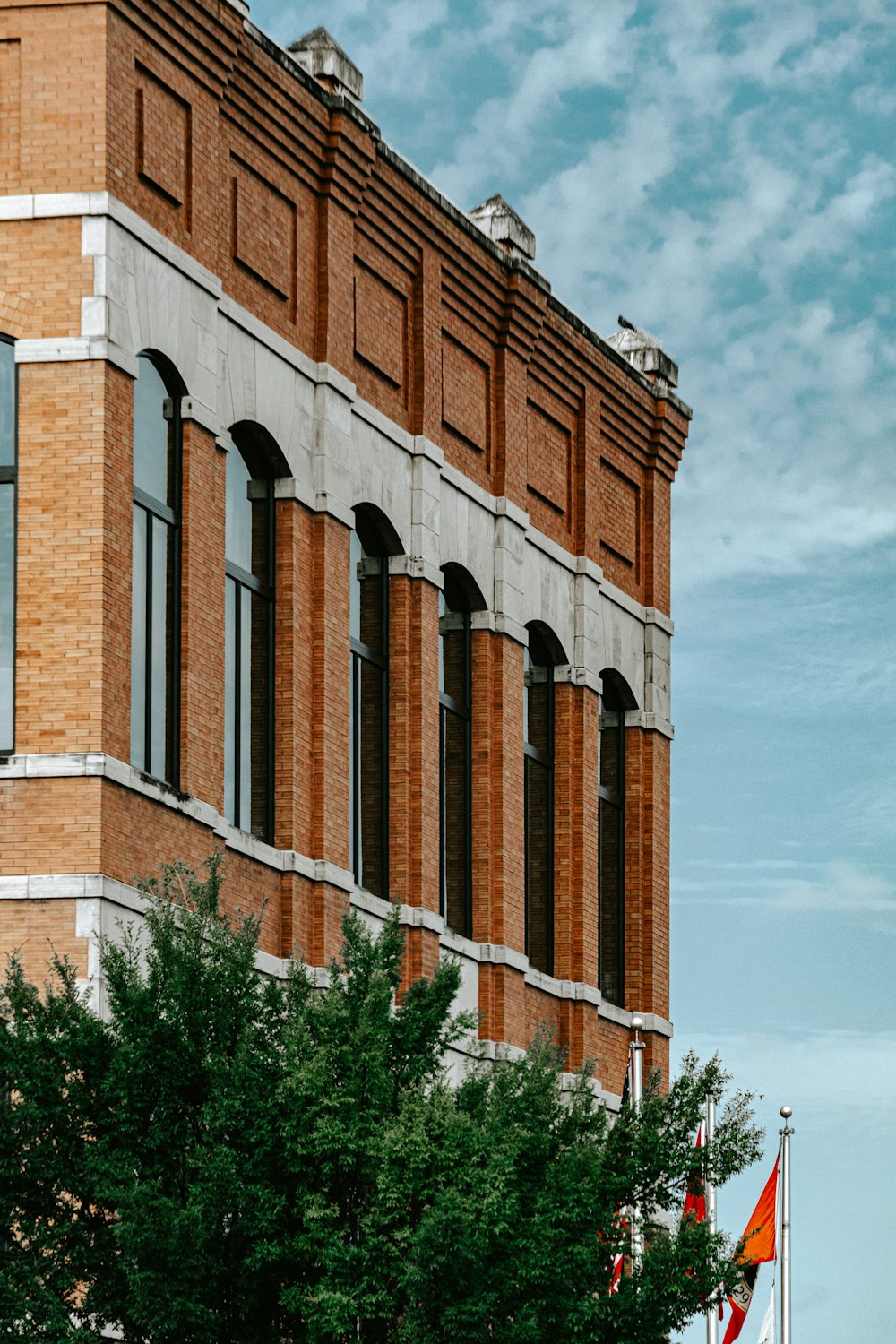 brown brick building under blue sky during daytime