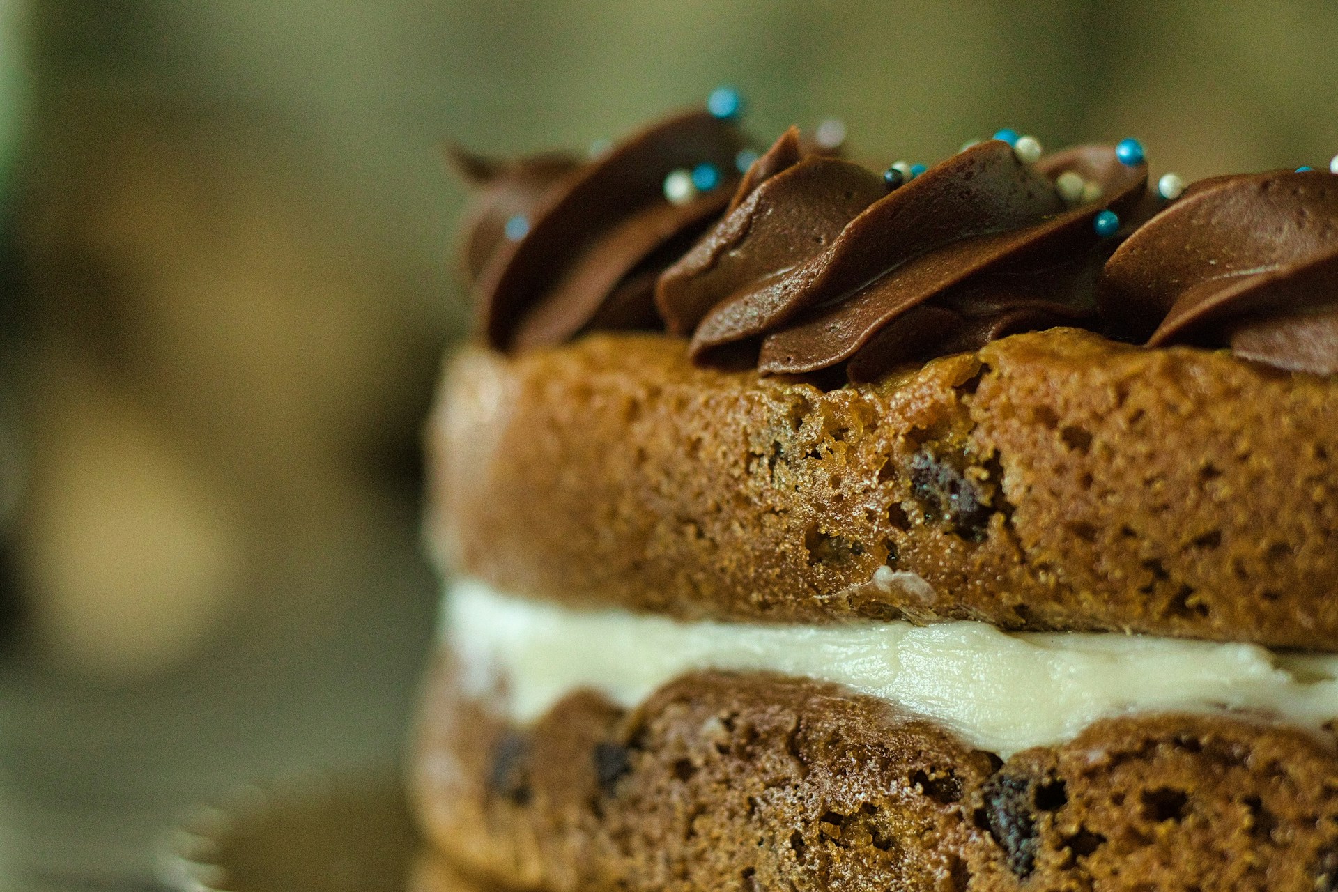 brown and white pastry with white cream on top
