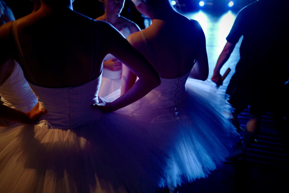 man and woman dancing on stage