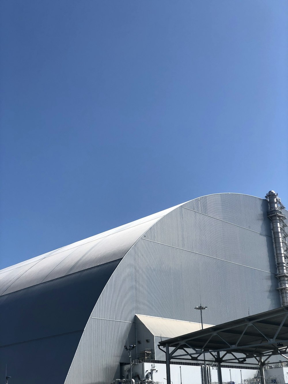 gray concrete building under blue sky during daytime