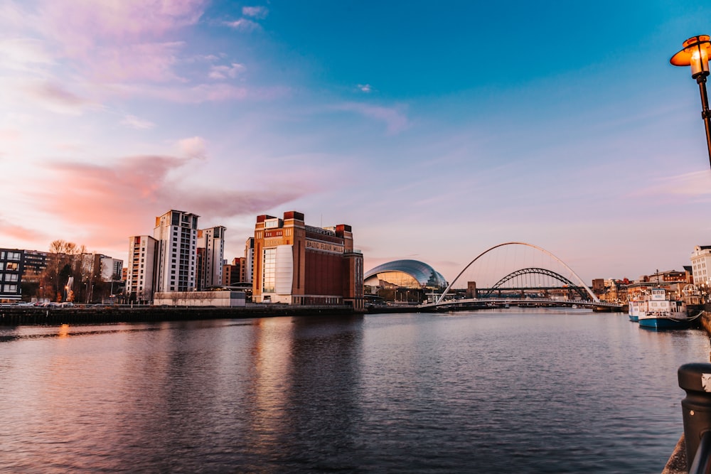 city skyline across body of water during daytime