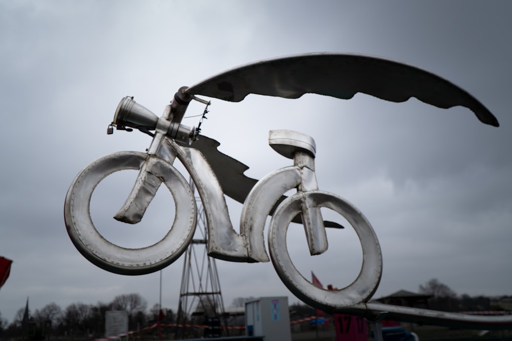 gray bicycle on gray metal stand