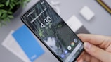 person holding black android smartphone
