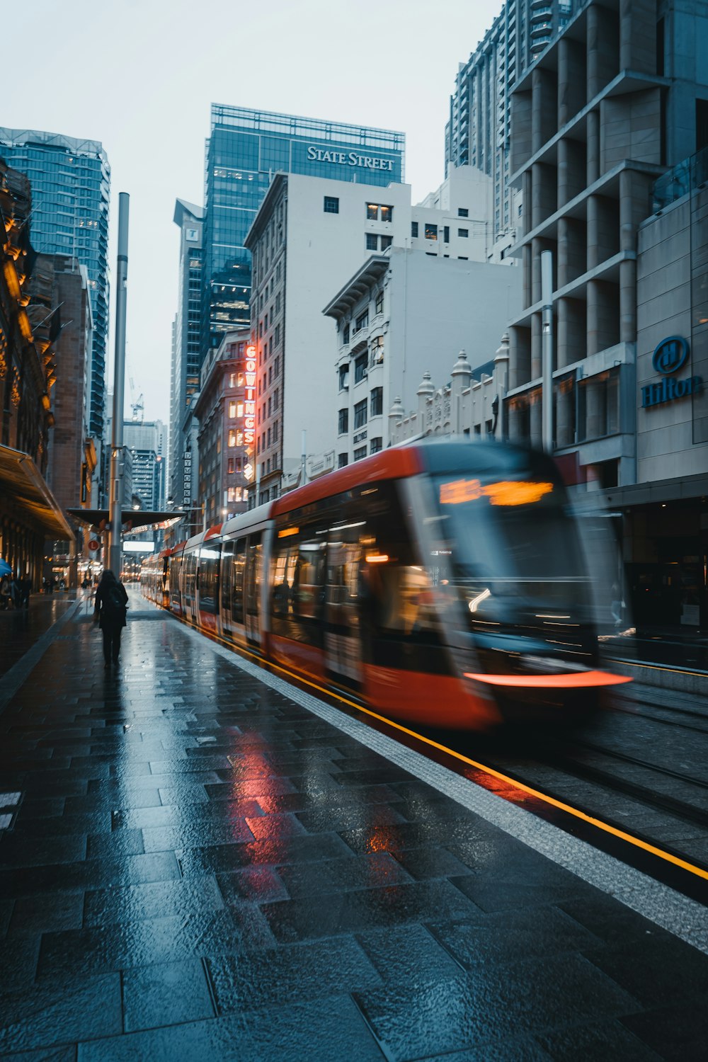 white and black train on city street during daytime