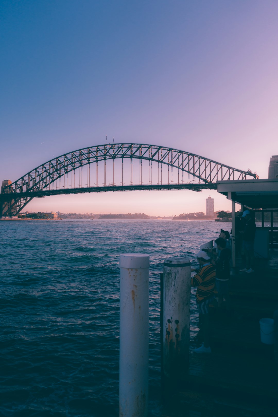 gray metal bridge over the sea