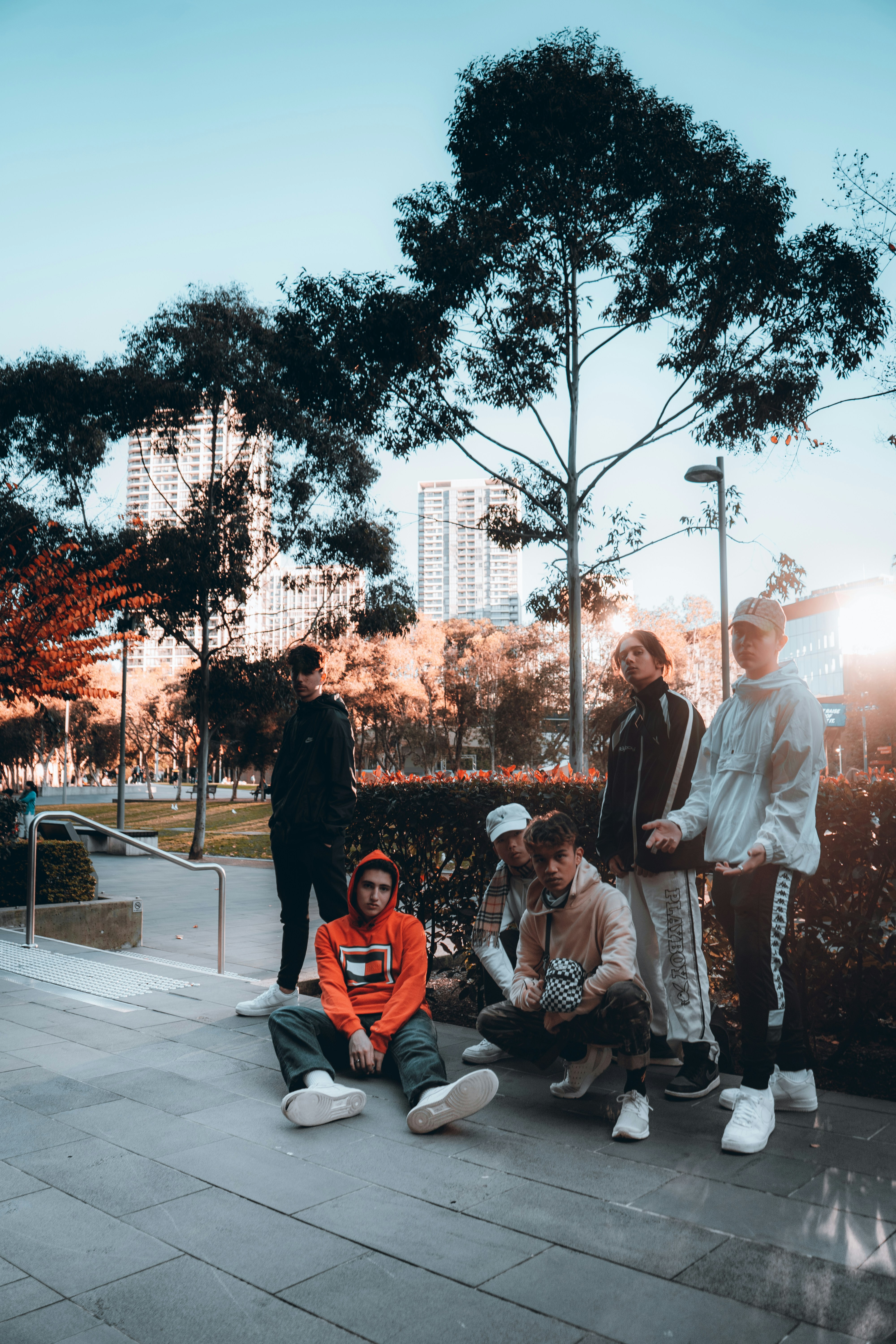group of people sitting on white bench during daytime