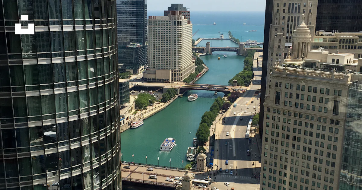 High rise buildings near river during daytime photo – Free Water Image ...