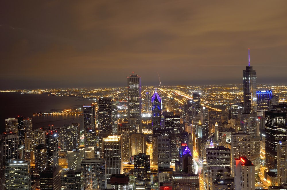 city with high rise buildings during night time