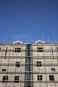 Wide shot of scaffolding being used on a multi-story building exterior.