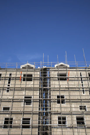 Completed multi-story building with scaffolding removed, ready for use.