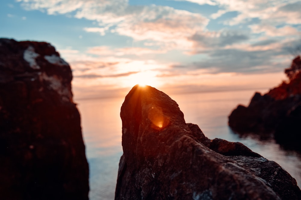 silhouette of rock formation during sunset