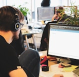 man in black shirt wearing black headphones