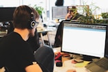 man in black shirt wearing black headphones