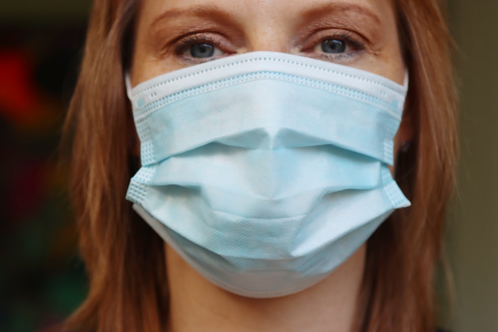 woman in white face mask